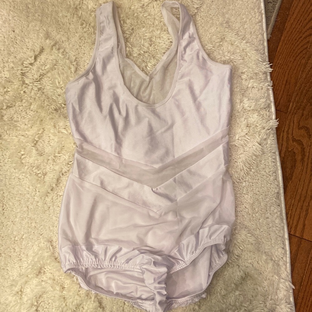 Women’s cotton, polyester, and spandex bodysuit in large. Never worn.